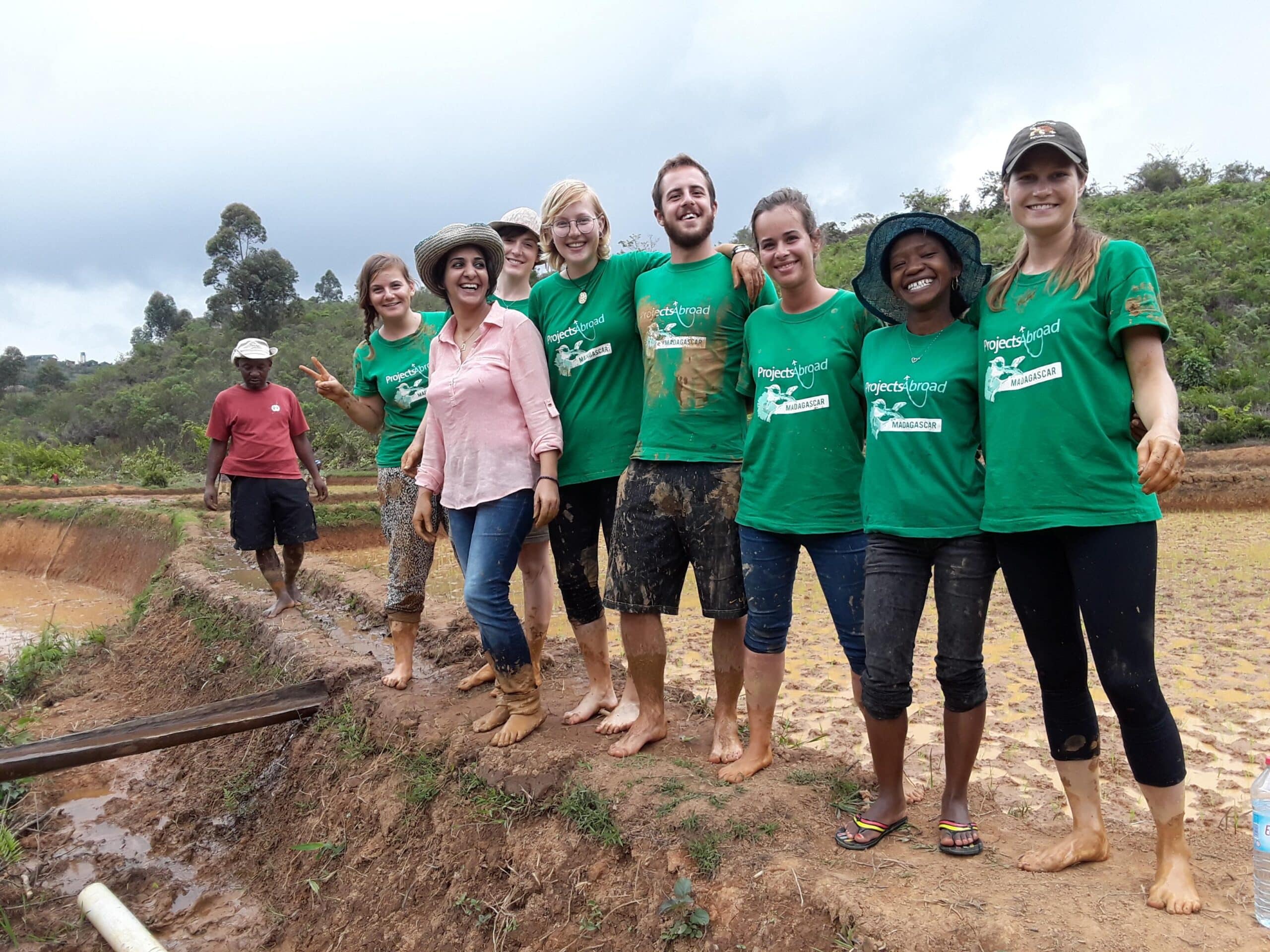 Volunteers take a group photo after their work day abroad in Madagascar