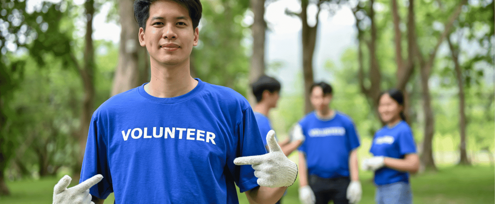 A volunteer posing in a new t-shirt
