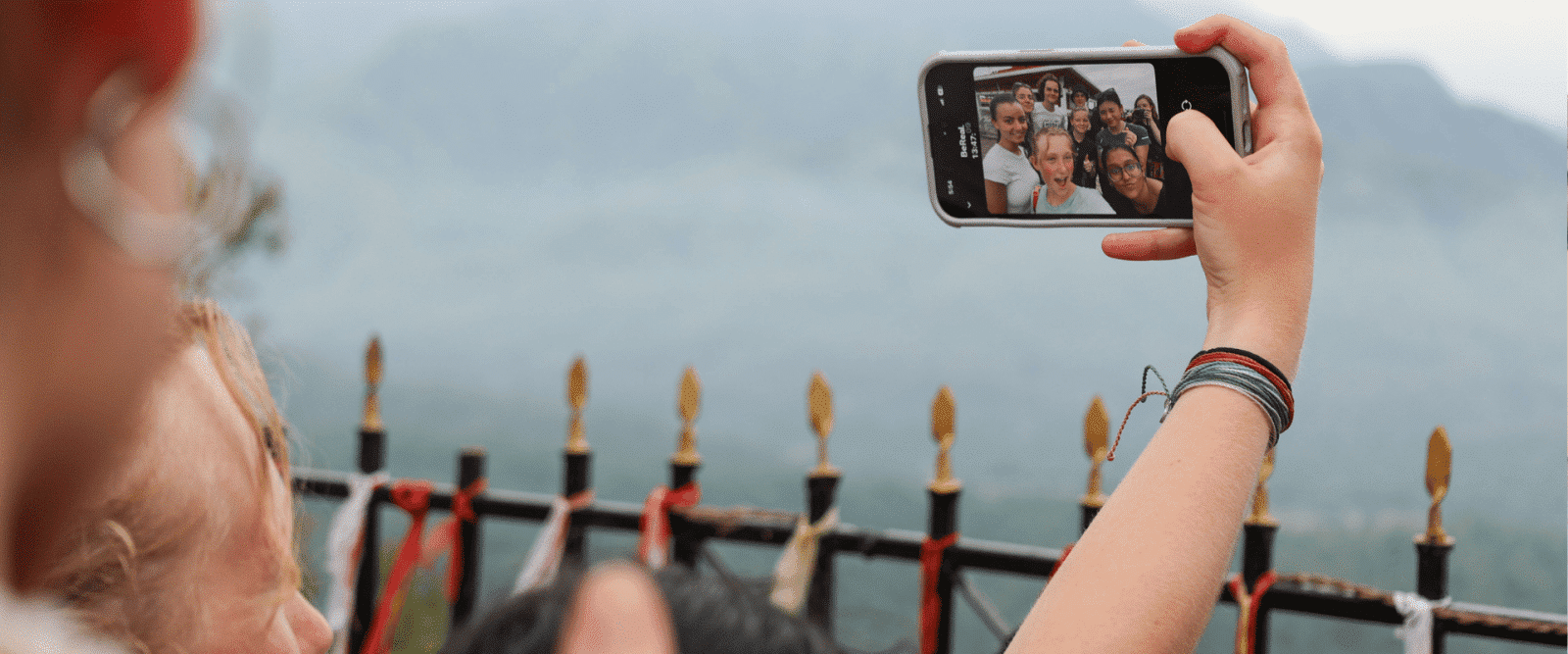A volunteer takes a selfie at a temple in Chitwan